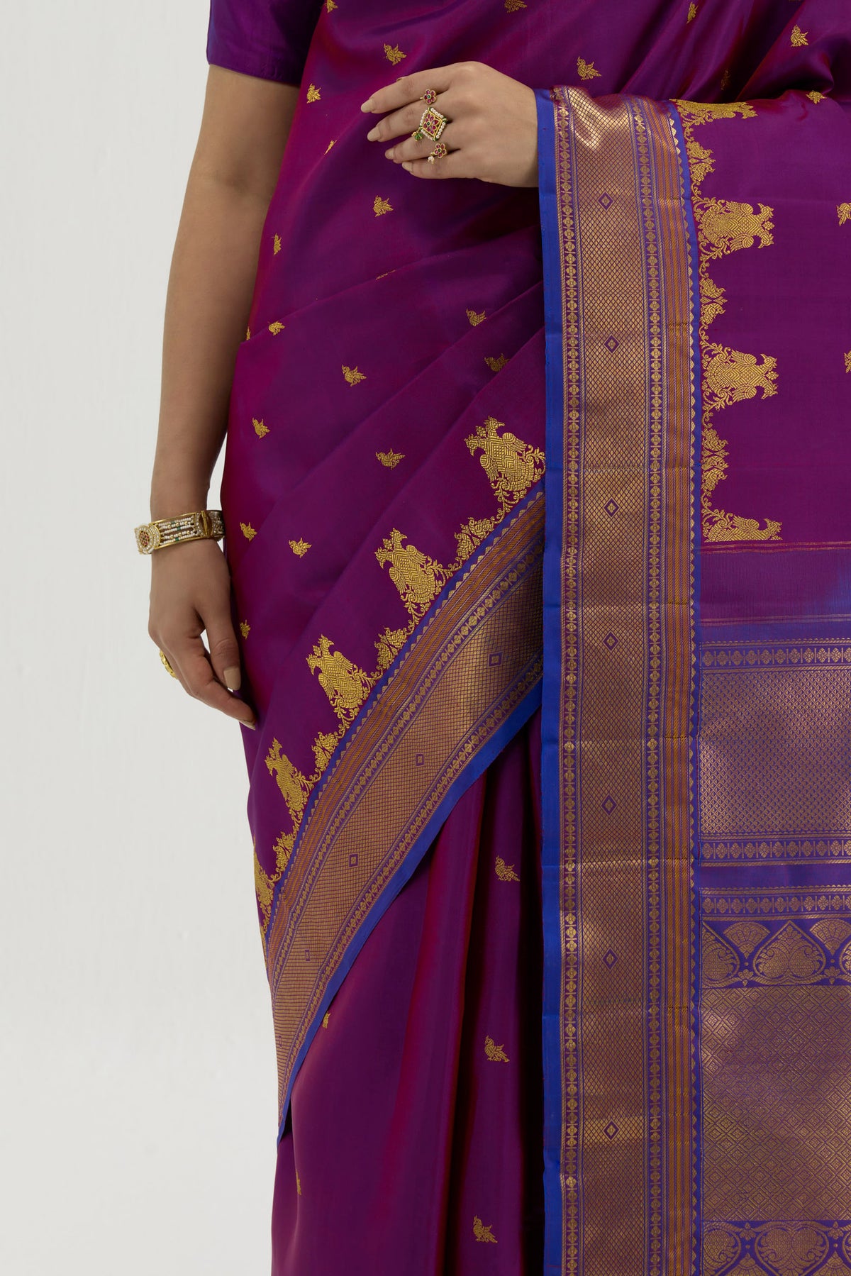 Close up image of the blouse of Purple Kanchipuram Silk Saree with Zari Butta on the body and Zari Border