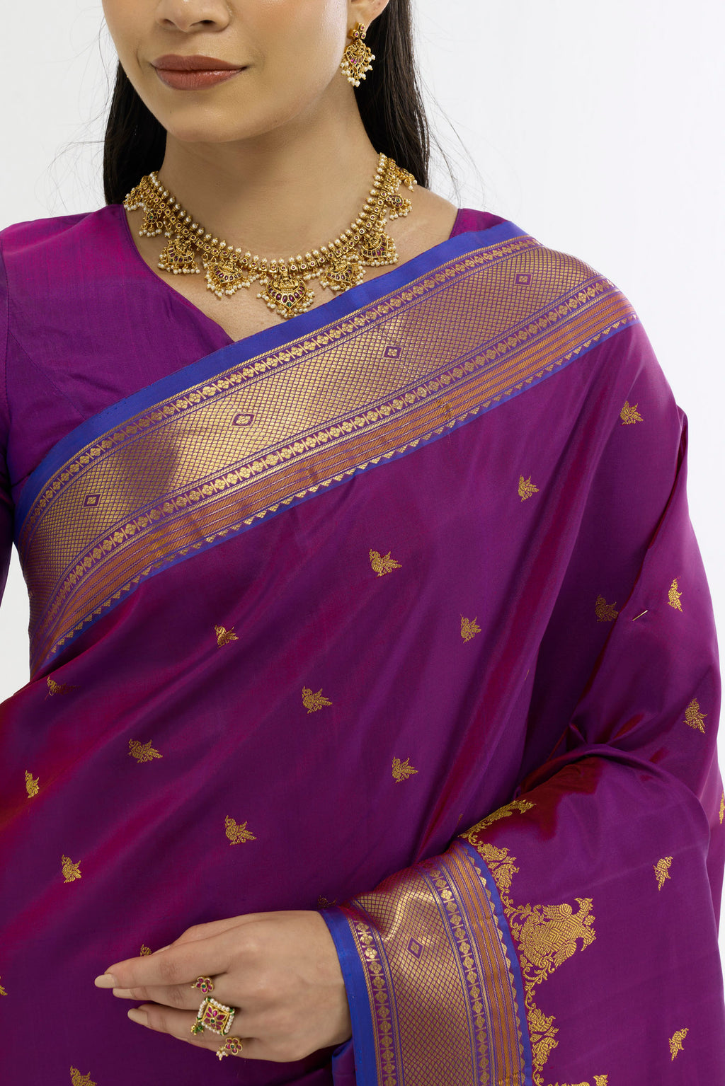 Border image of Purple Kanchipuram Silk Saree with Zari Butta on the body and Zari Border