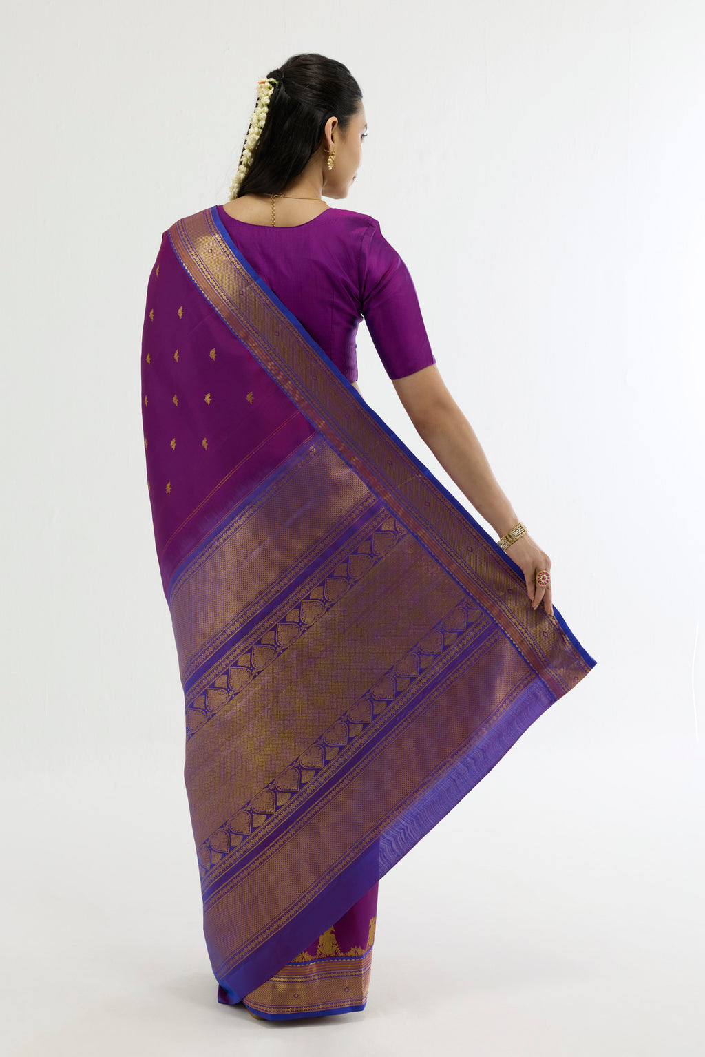 Flat view of Purple Kanchipuram Silk Saree with Zari Butta on the body and Zari Border