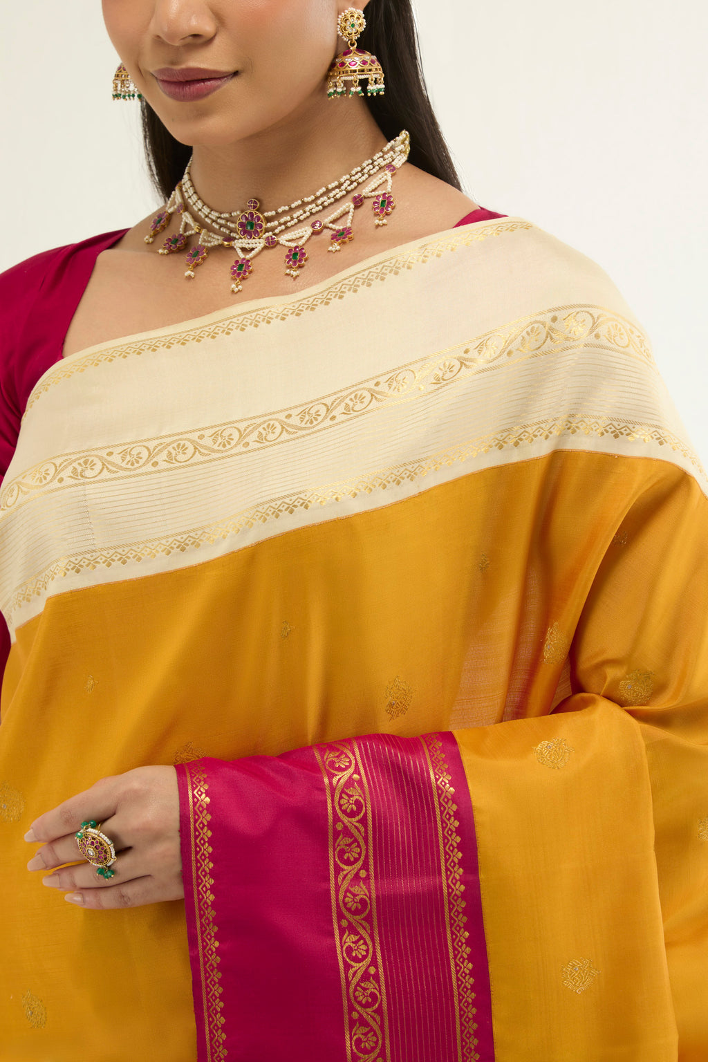 Border image of Yellow Kanchipuram Silk Saree with Zari Butta on the body and Ganga Jamuna Border