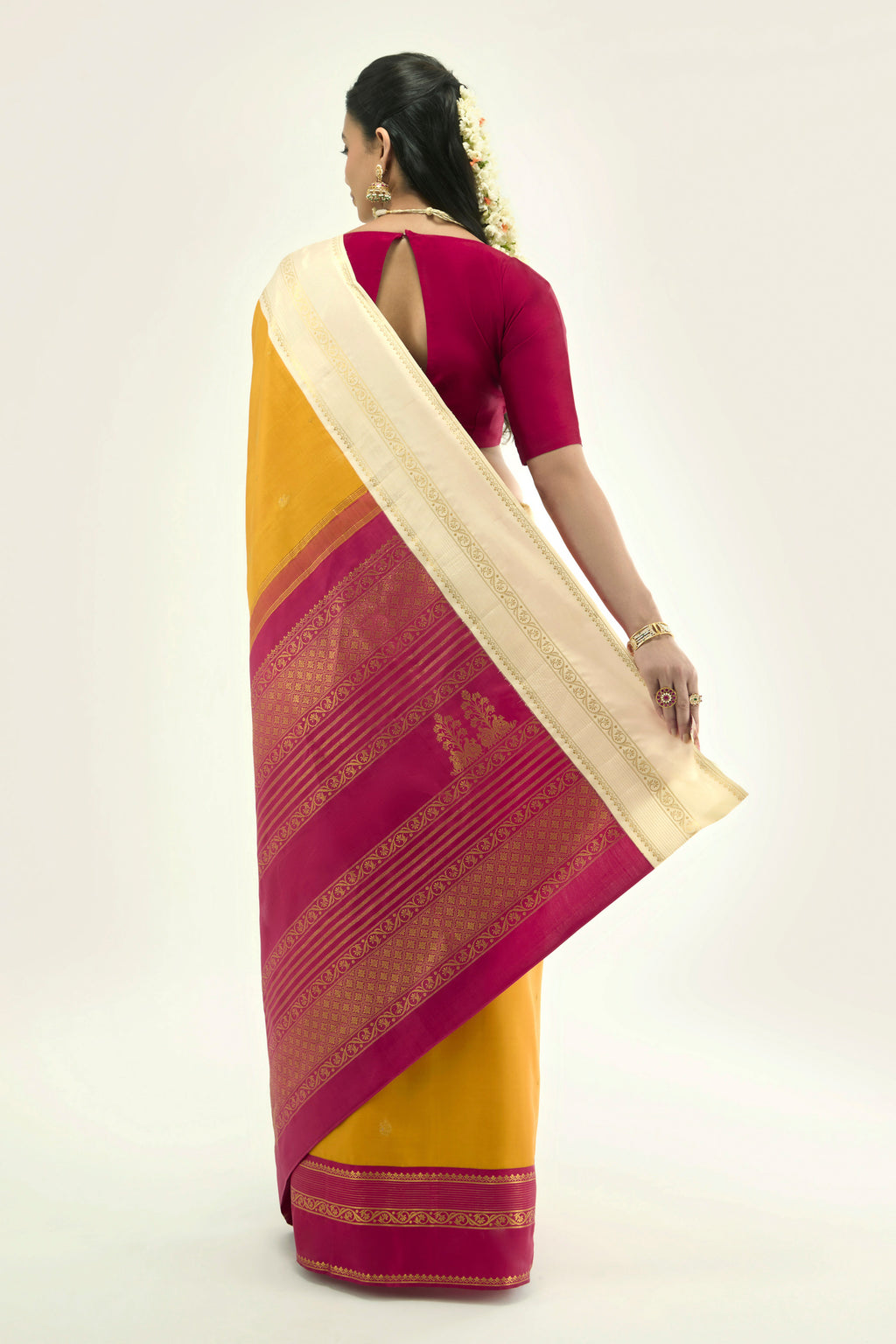 Flat view of Yellow Kanchipuram Silk Saree with Zari Butta on the body and Ganga Jamuna Border