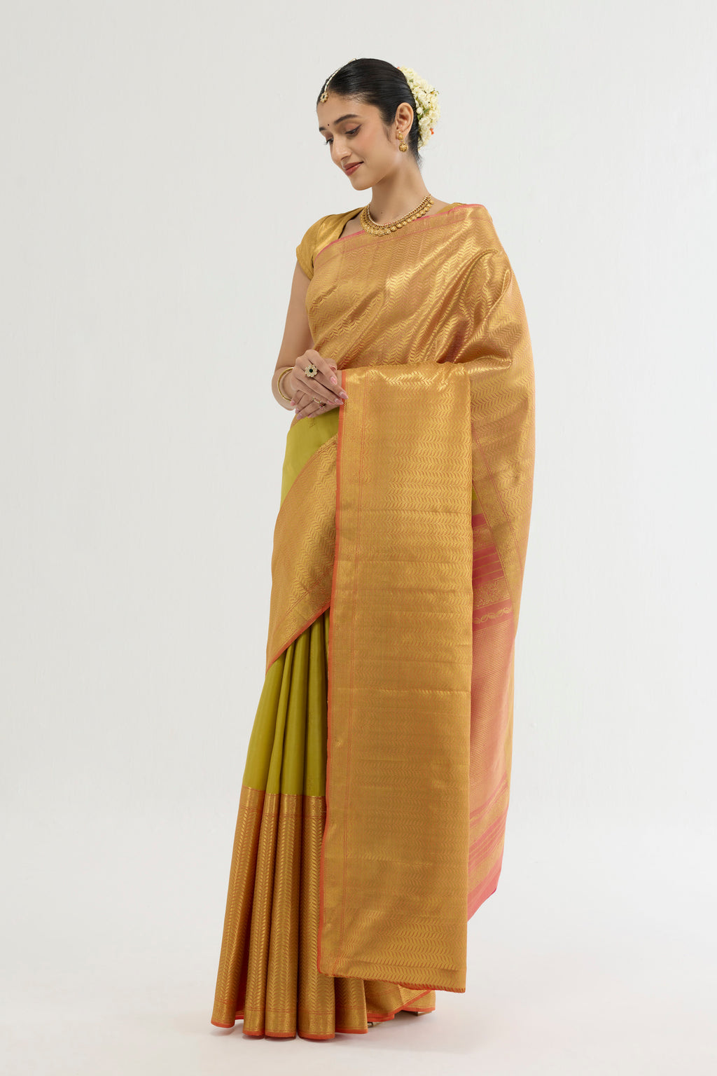 Close up of Multi Color Kanchipuram Silk Saree with Zari Butta on the body and Zari Border displaying folds
