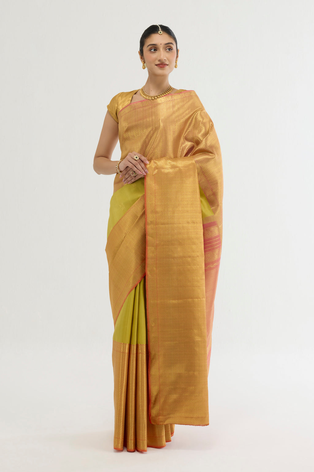 Multi Color Kanchipuram Silk Saree with Zari Butta on the body and Zari Border displayed on a mannequin