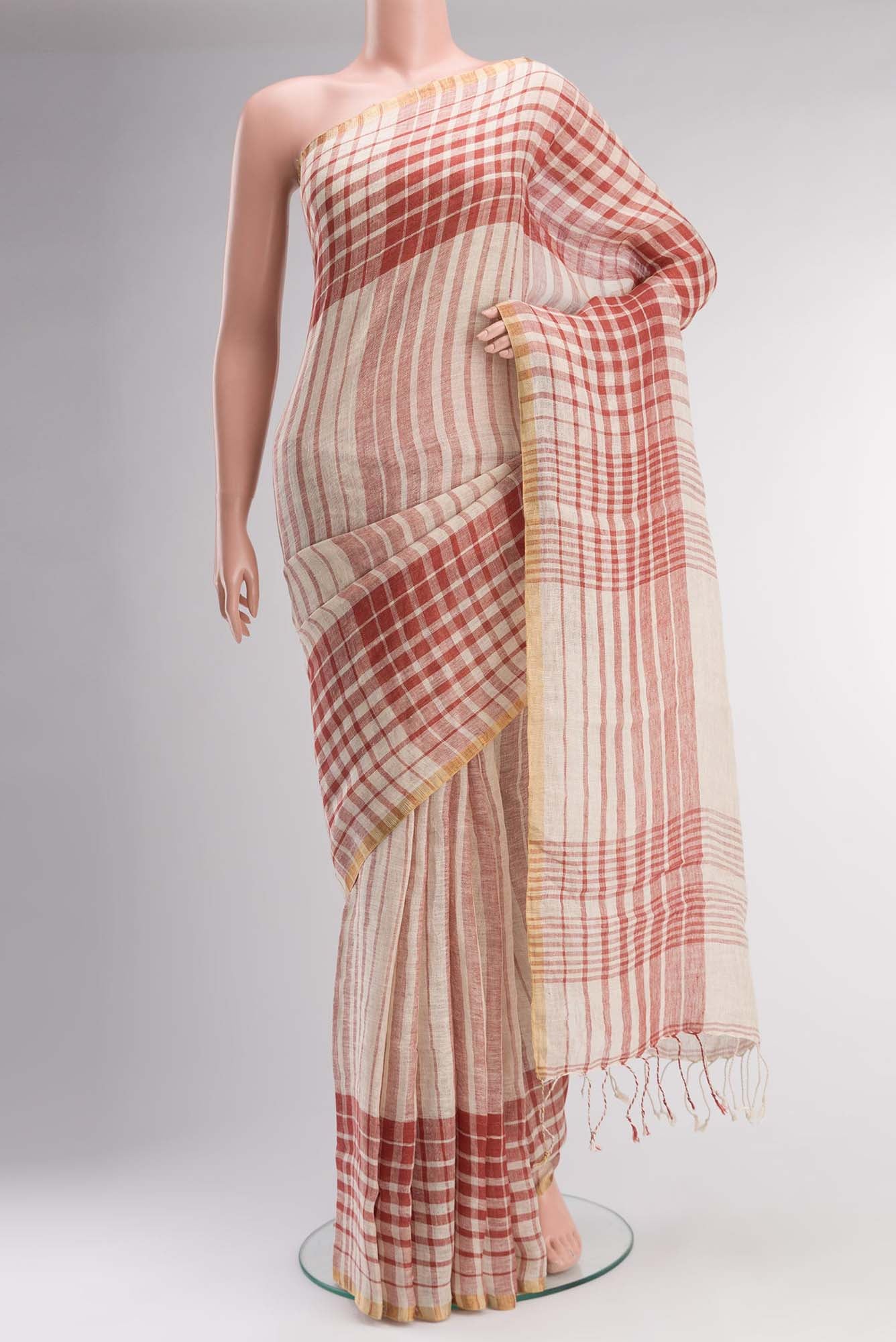 Cream Linen Saree with Stripes on the body and Checks Border.  displayed on a mannequin