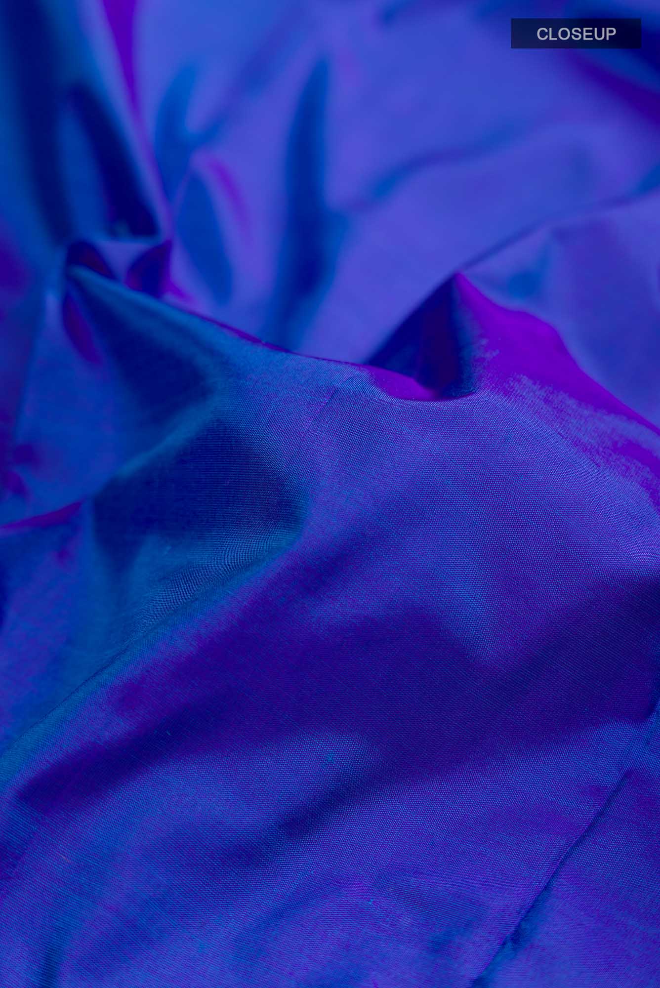 Close up of Magenta Blended Satin Silk Saree with Embroidery on the body and Fancy Border.  displaying folds