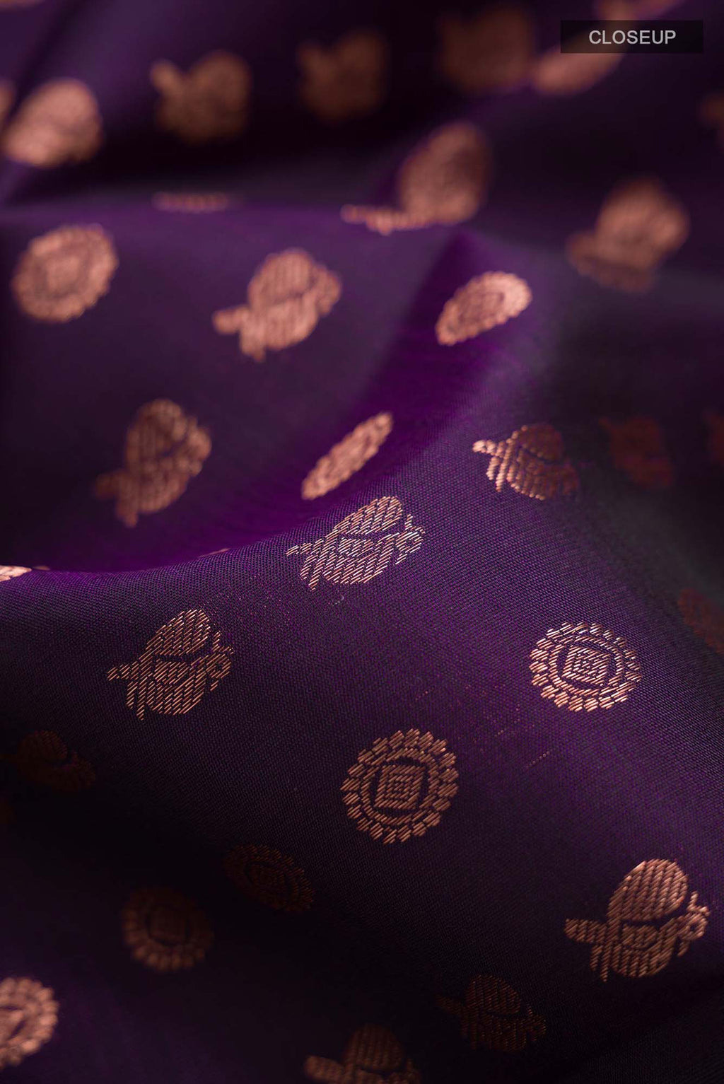 Close up of Sandal Mysore Crepe Silk Saree with Floral Print on the body and Zari Border.  displaying folds