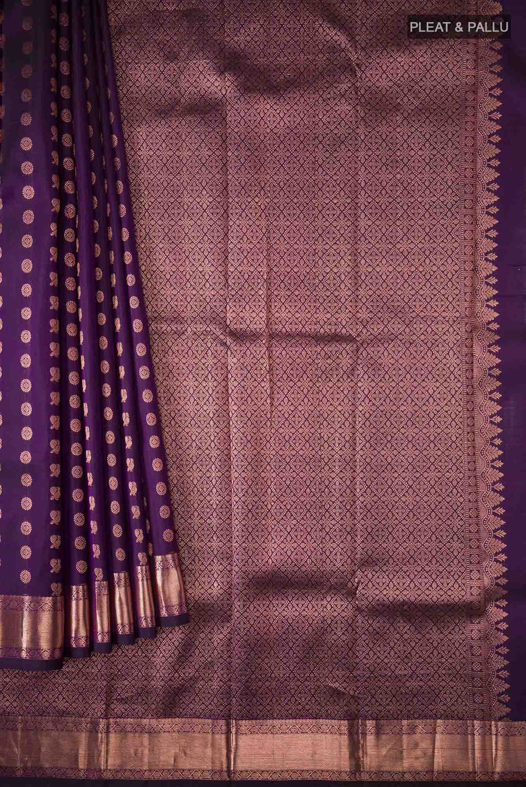 Pleats and pallu of Sandal Mysore Crepe Silk Saree with Floral Print on the body and Zari Border. 