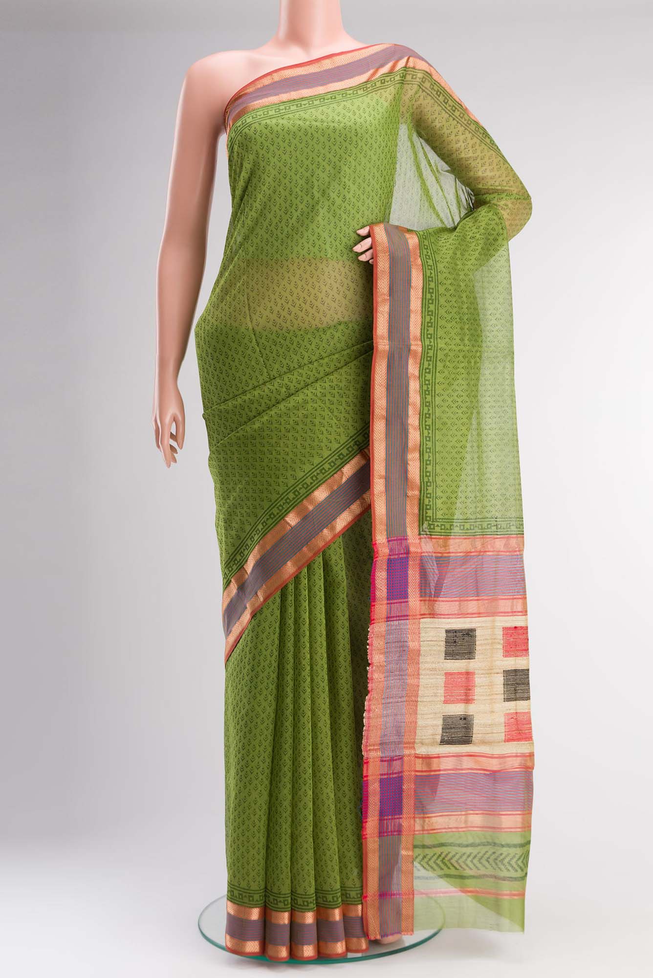 Green Maheshwari Silk Cotton Saree with Printed design on the body and Zari Border.  displayed on a mannequin