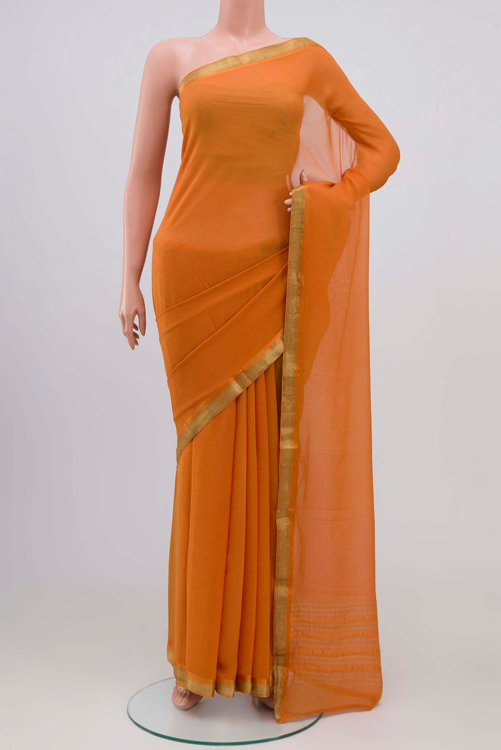 Orange Mysore Chiffon Saree with Plain Body and Zari Border.  displayed on a mannequin
