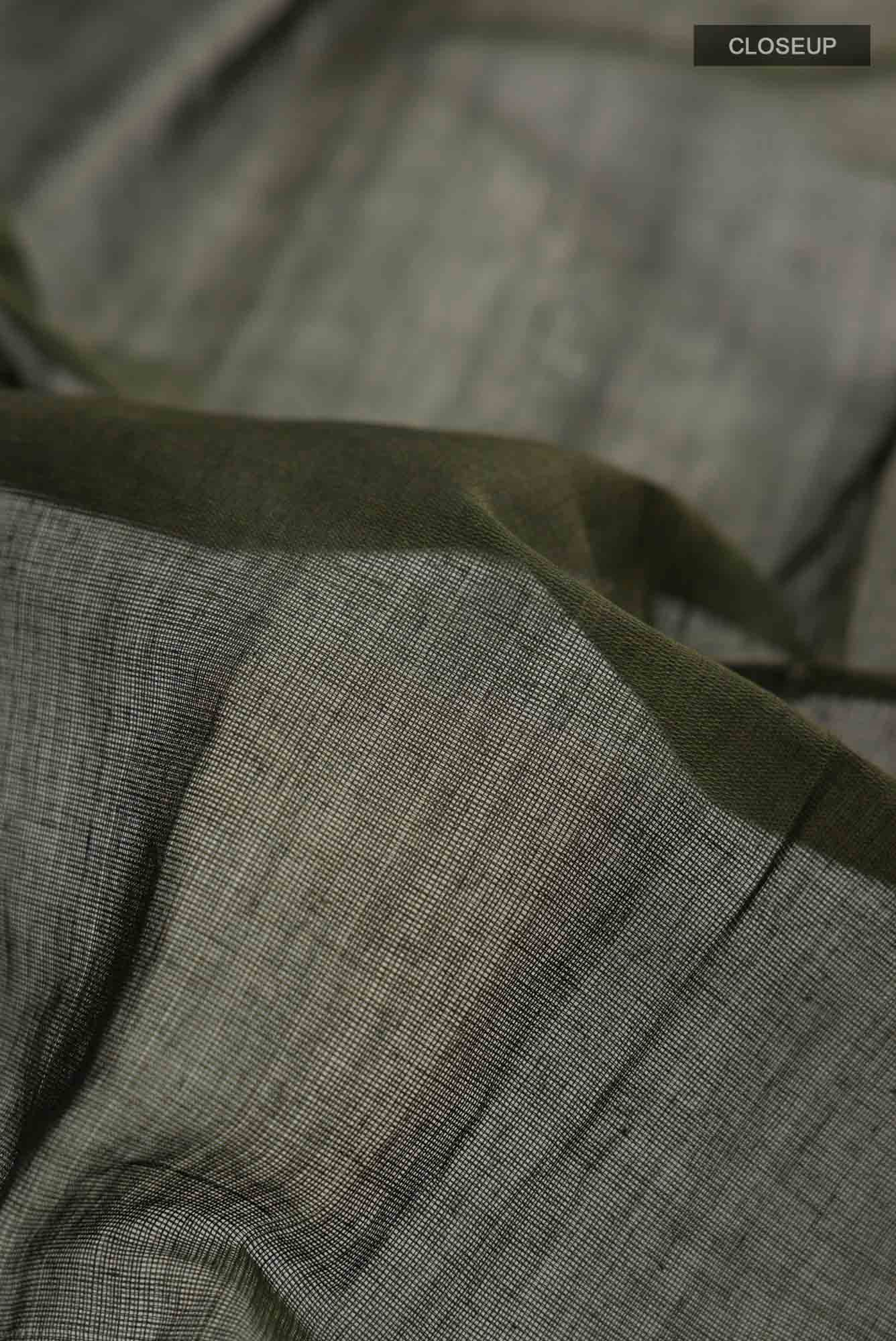 Close up of Green Orissa Cotton Saree with Plain Body and Plain Border.  displaying folds
