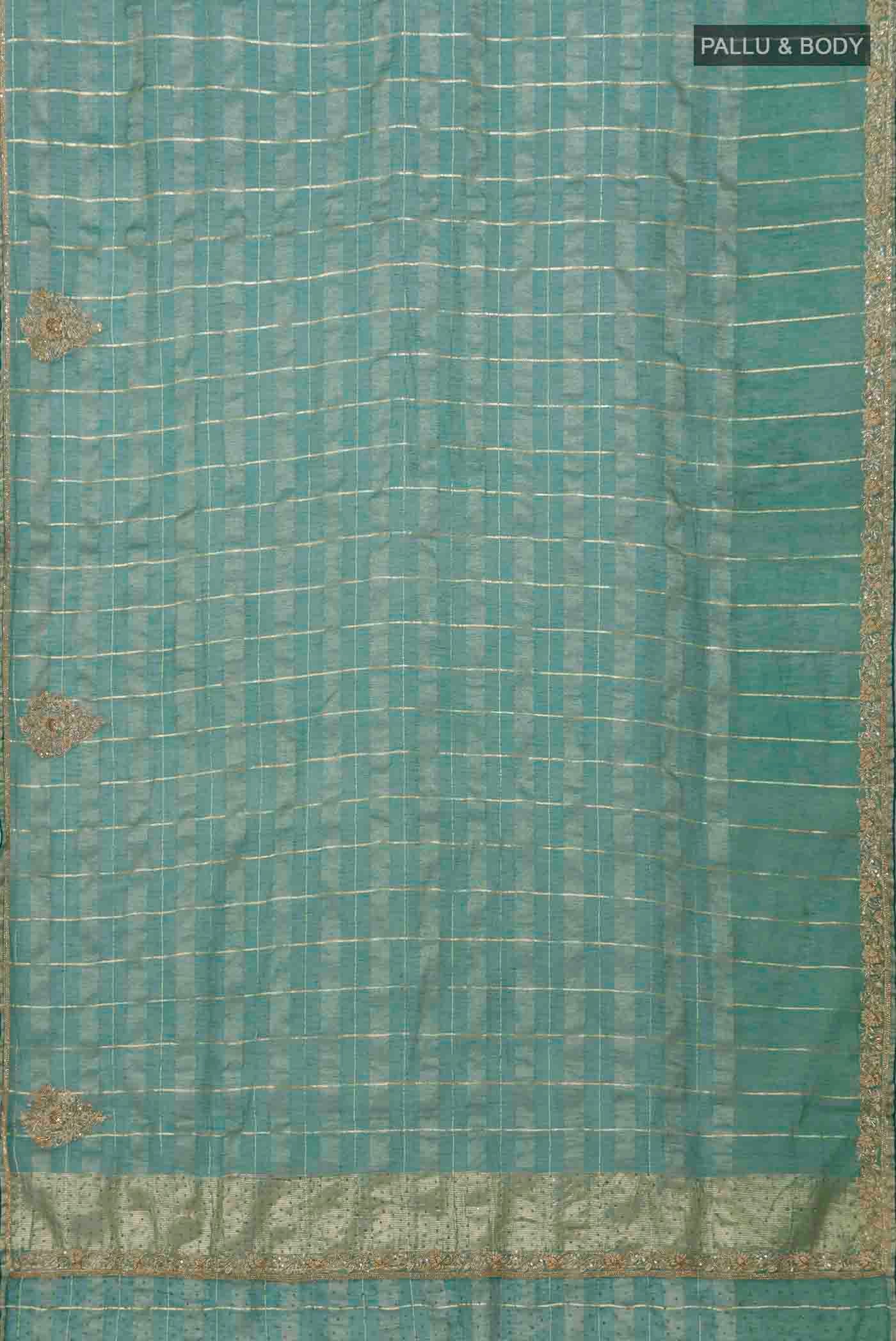 Flat view of Green Linen Saree with Checked design on the body and Embroidery Border. 