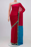 Red Mysore Crepe Saree with Plain Body and Zari Border.  displayed on a mannequin
