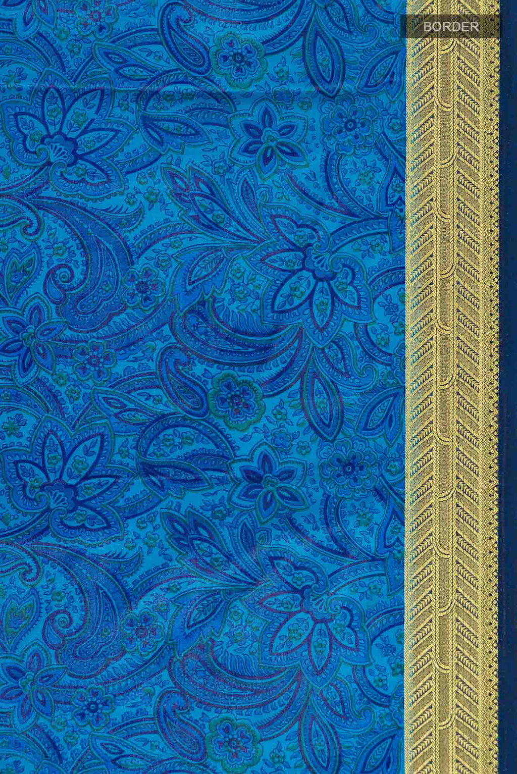 Border image of Blue Blended Crepe Saree with Floral Print on the body and Zari Border. 