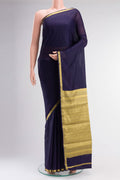 Navy Blue Blended Crepe Saree with Plain Body and Zari Border.  displayed on a mannequin