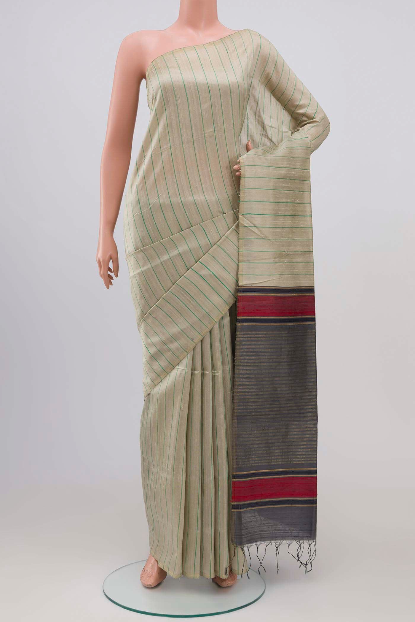 Sage Green Raw Silk Saree with Stripes on the body and Zari Border.  displayed on a mannequin