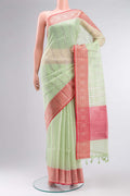 Green Blended Kora Cotton Saree with Zari Butta on the body and Zari Border.  displayed on a mannequin