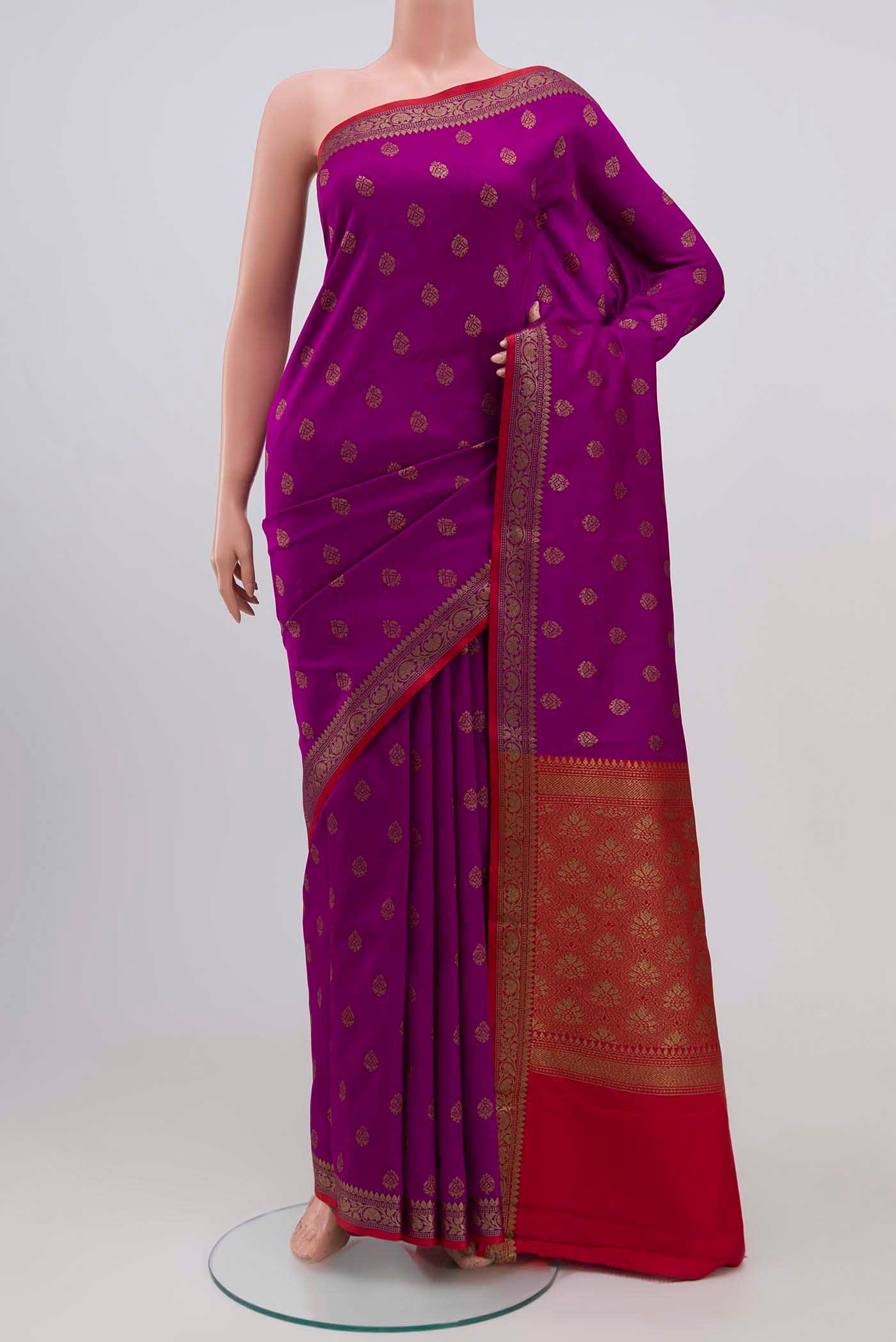 Magenta Blended Art Silk Saree with Zari Butta on the body and Zari Border.  displayed on a mannequin