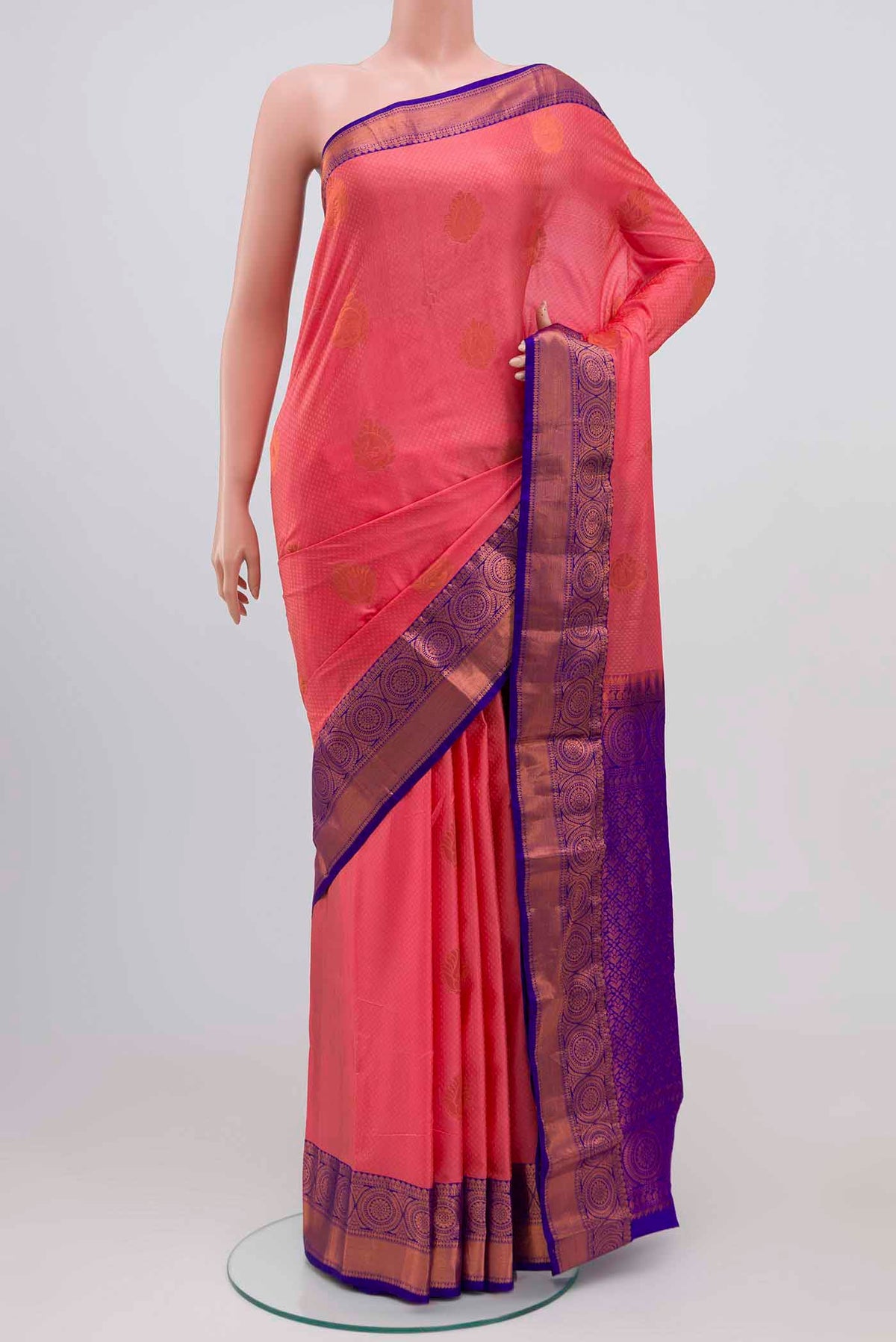 Coral Blended Kanjivaram Silk Saree with Jacquard With Zari Butta on the body and Zari Border.  displayed on a mannequin