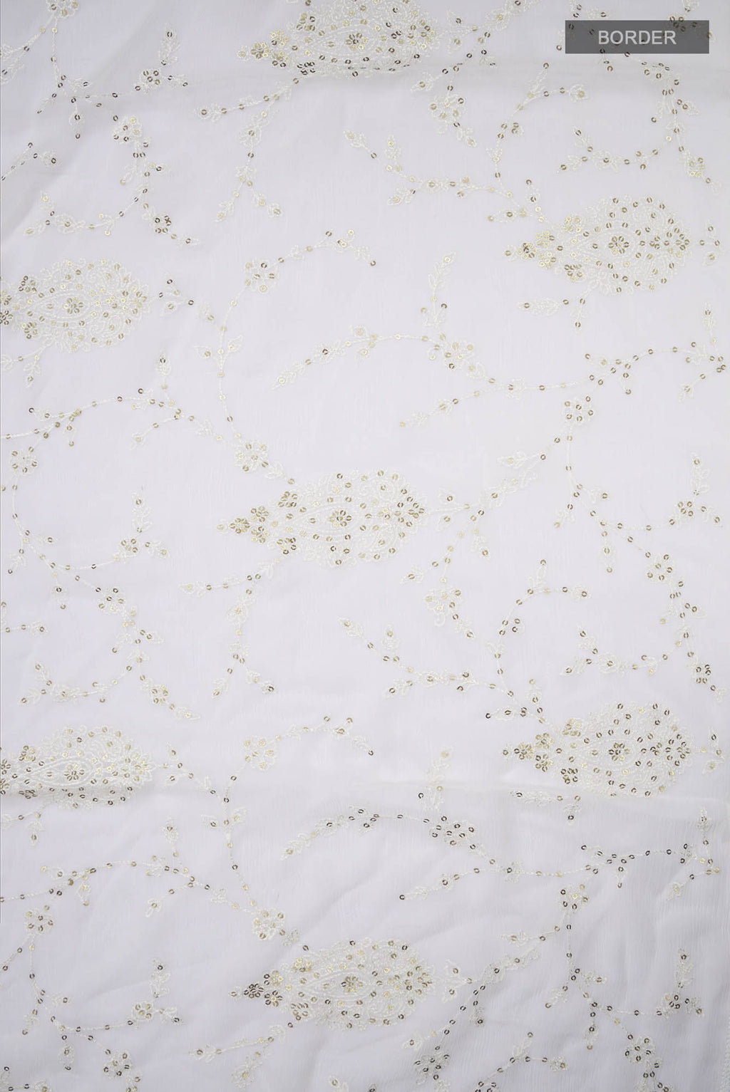 Border image of Cream Blended Chiffon Saree with Embroidery on the body and Lace Border. 