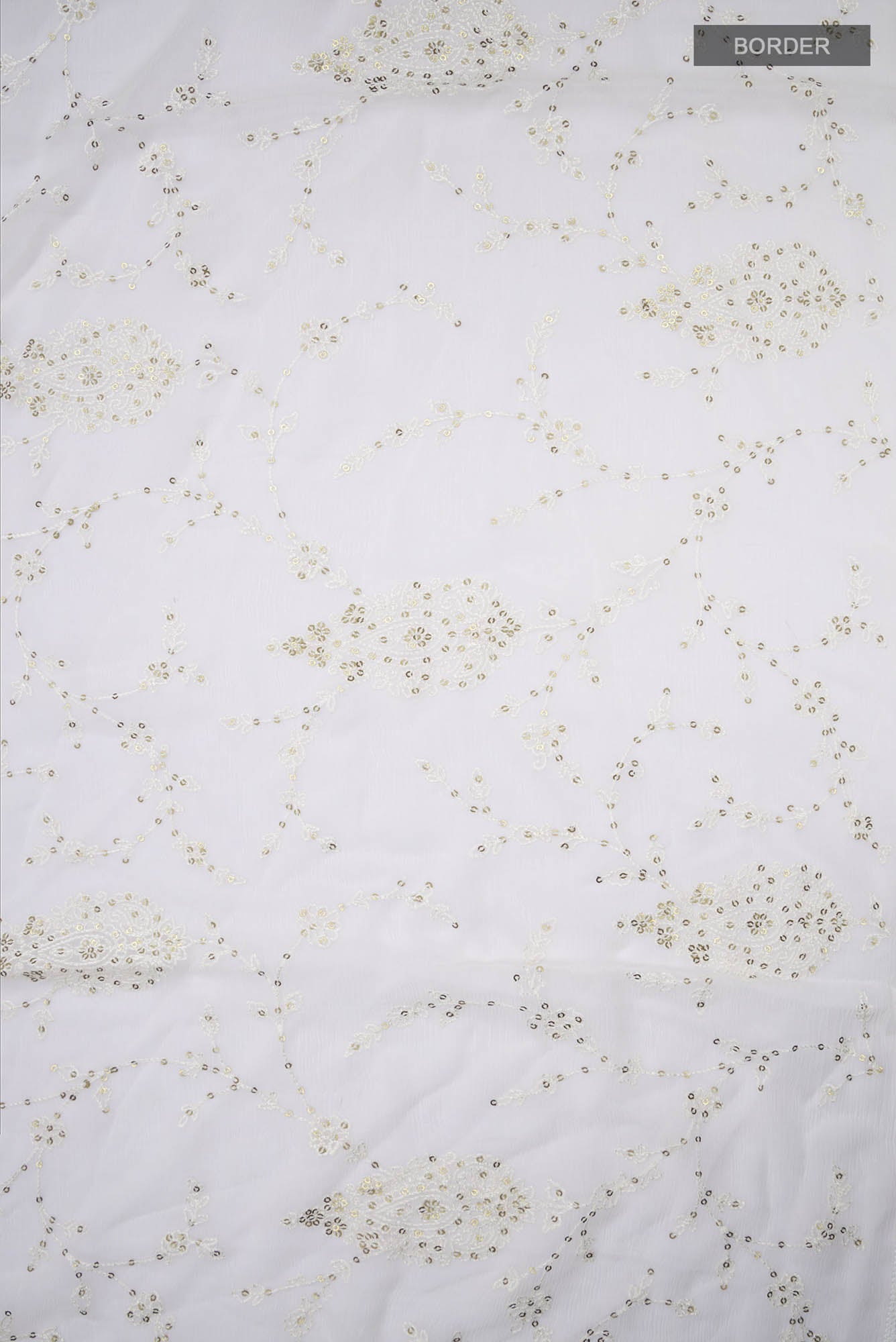 Border image of Cream Blended Chiffon Saree with Embroidery on the body and Lace Border. 