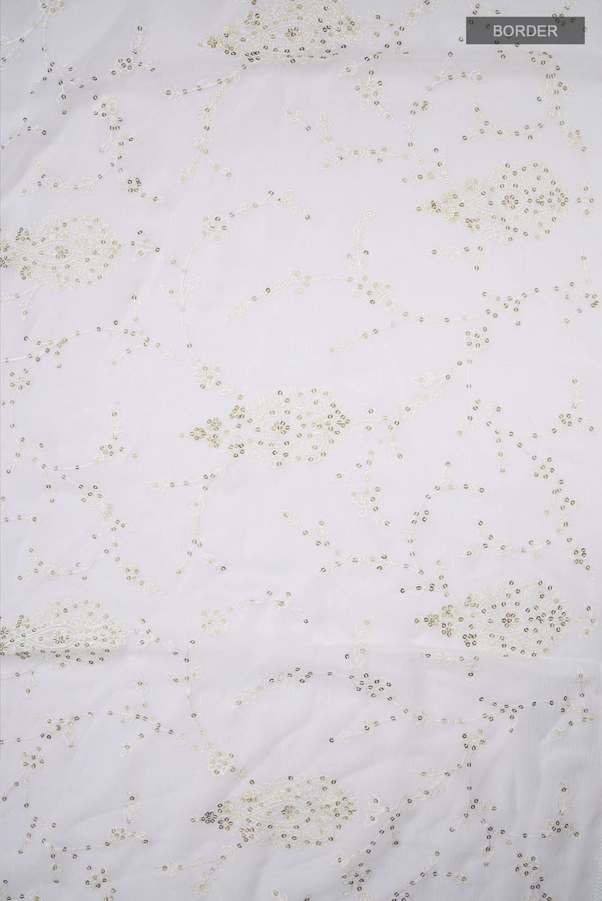 Border image of Cream Blended Chiffon Saree with Embroidery on the body and Lace Border. 