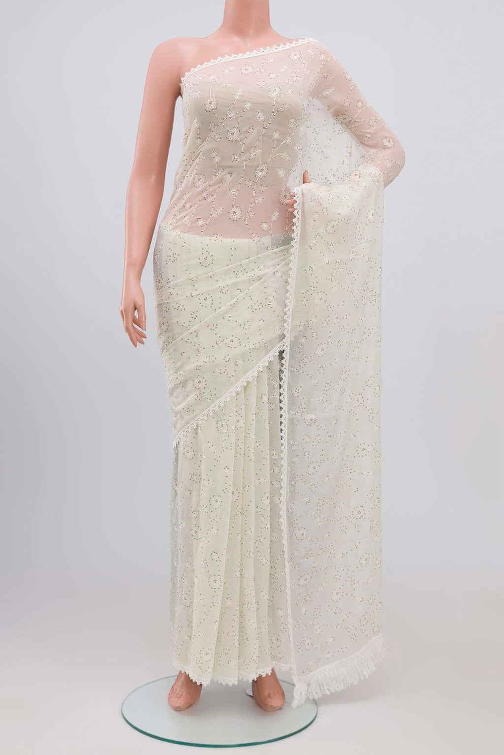Off White Blended Chiffon Saree with Embroidery on the body and Lace Border.  displayed on a mannequin
