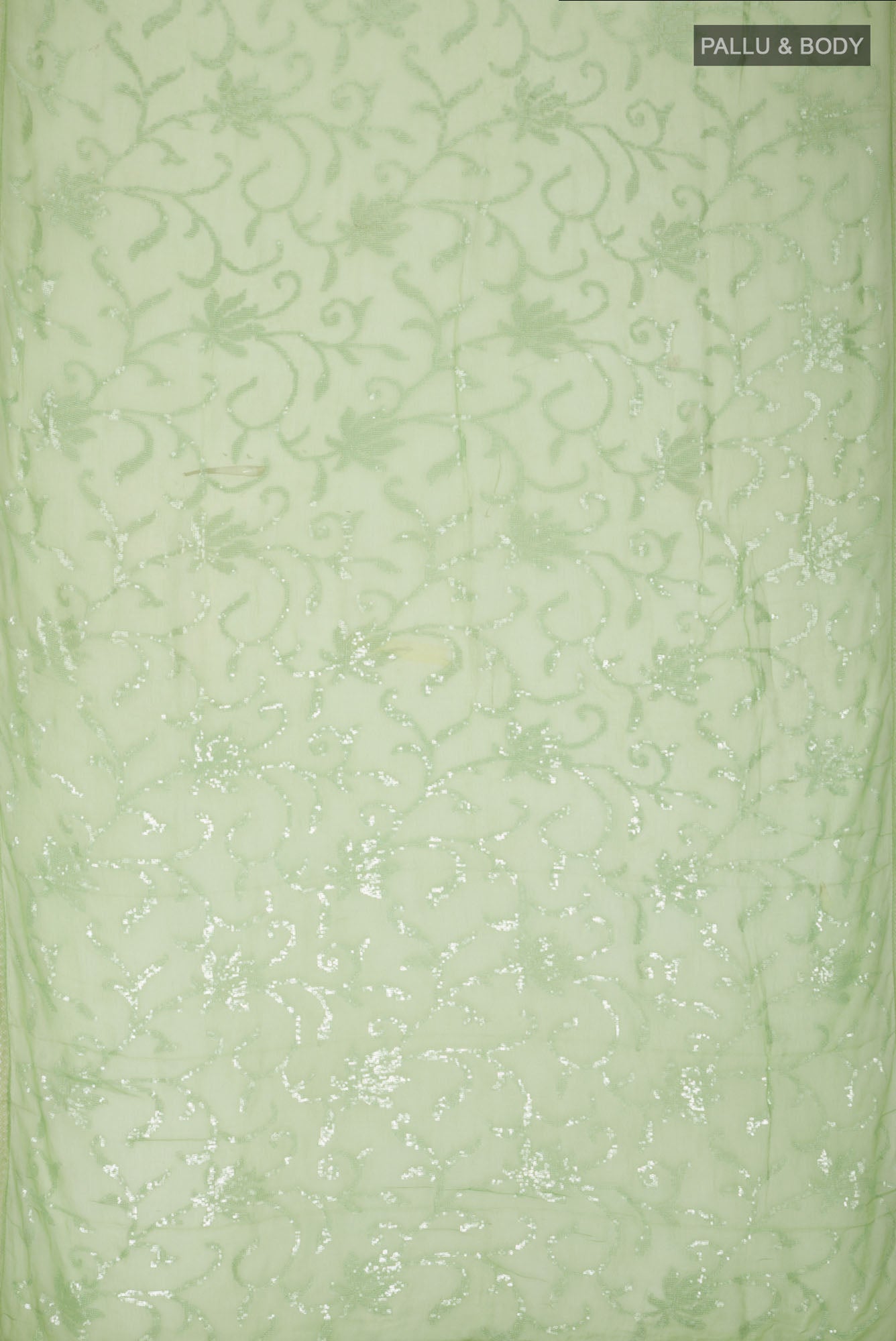 Flat view of Green Blended Chiffon Saree with Embroidery on the body and Lace Border. 