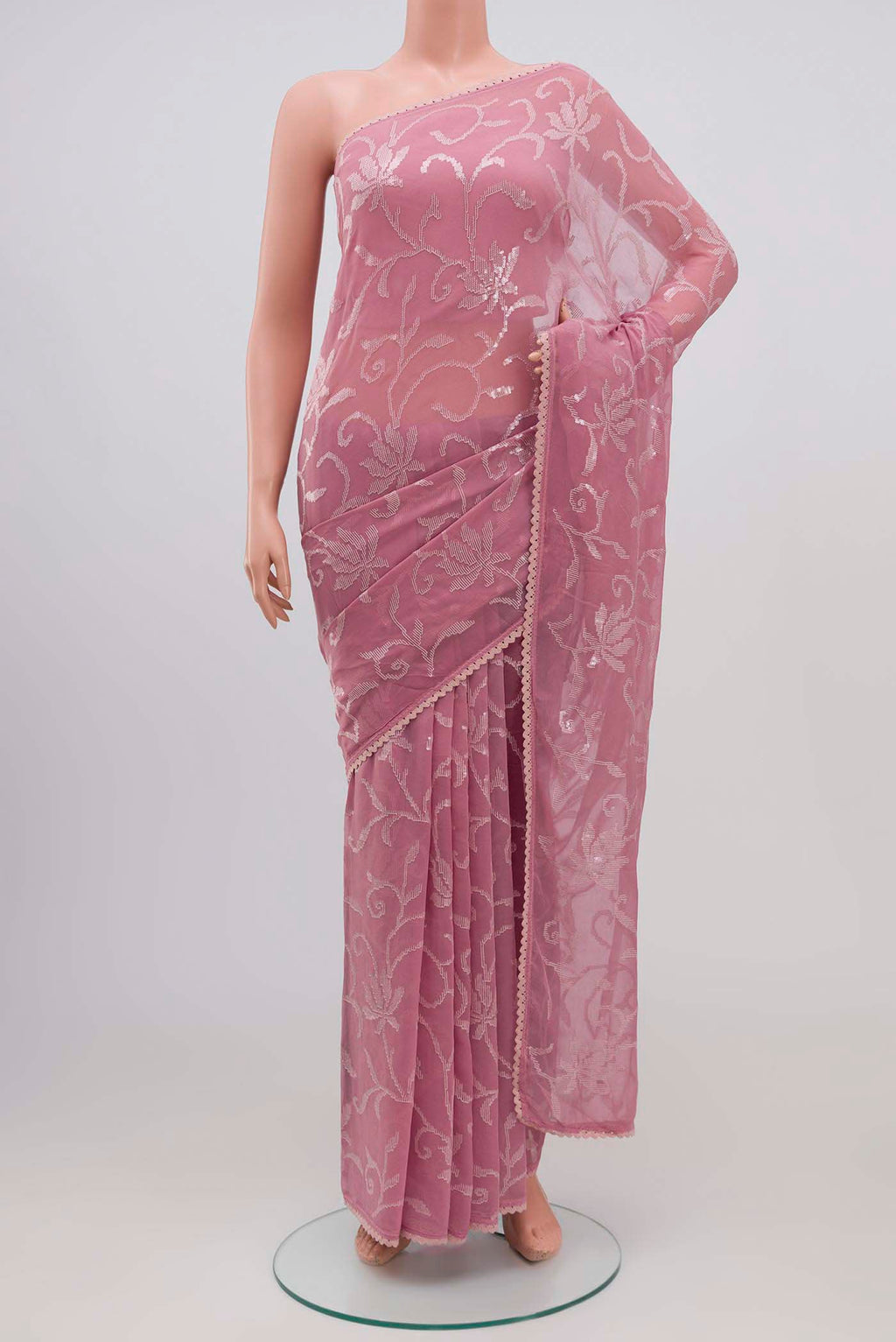 Pink Blended Chiffon Saree with Embroidery on the body and Lace Border.  displayed on a mannequin