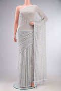 Grey Blended Chiffon Saree with Embroidery on the body and Lace Border.  displayed on a mannequin