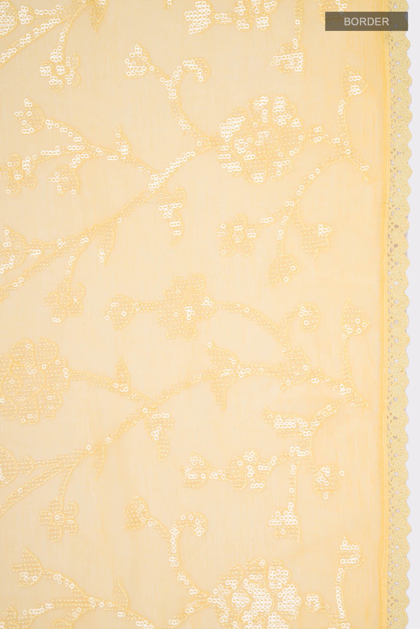 Border image of Yellow Blended Chiffon Saree with Embroidery on the body and Lace Border. 