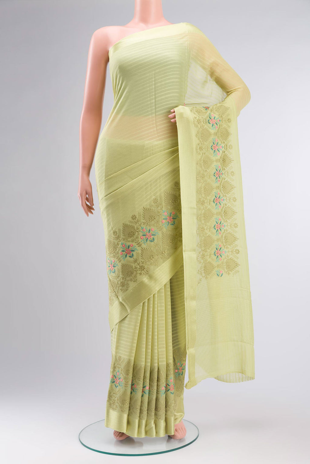 Green Mysore Chiffon Saree with Stripes on the body and Embroidery Border.  displayed on a mannequin