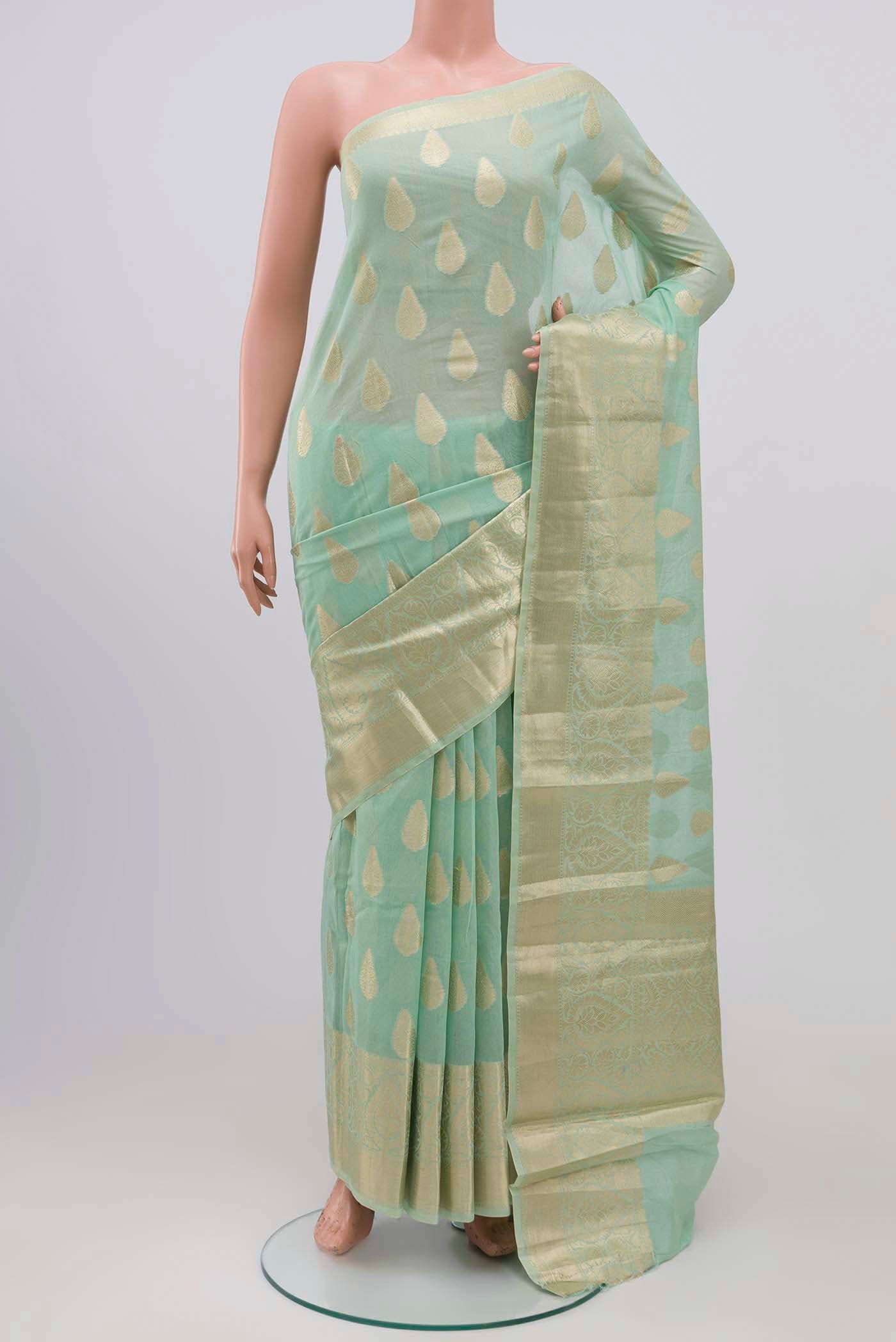 Mint Green Blended Silk Cotton Saree with Zari Butta on the body and Zari Border.  displayed on a mannequin