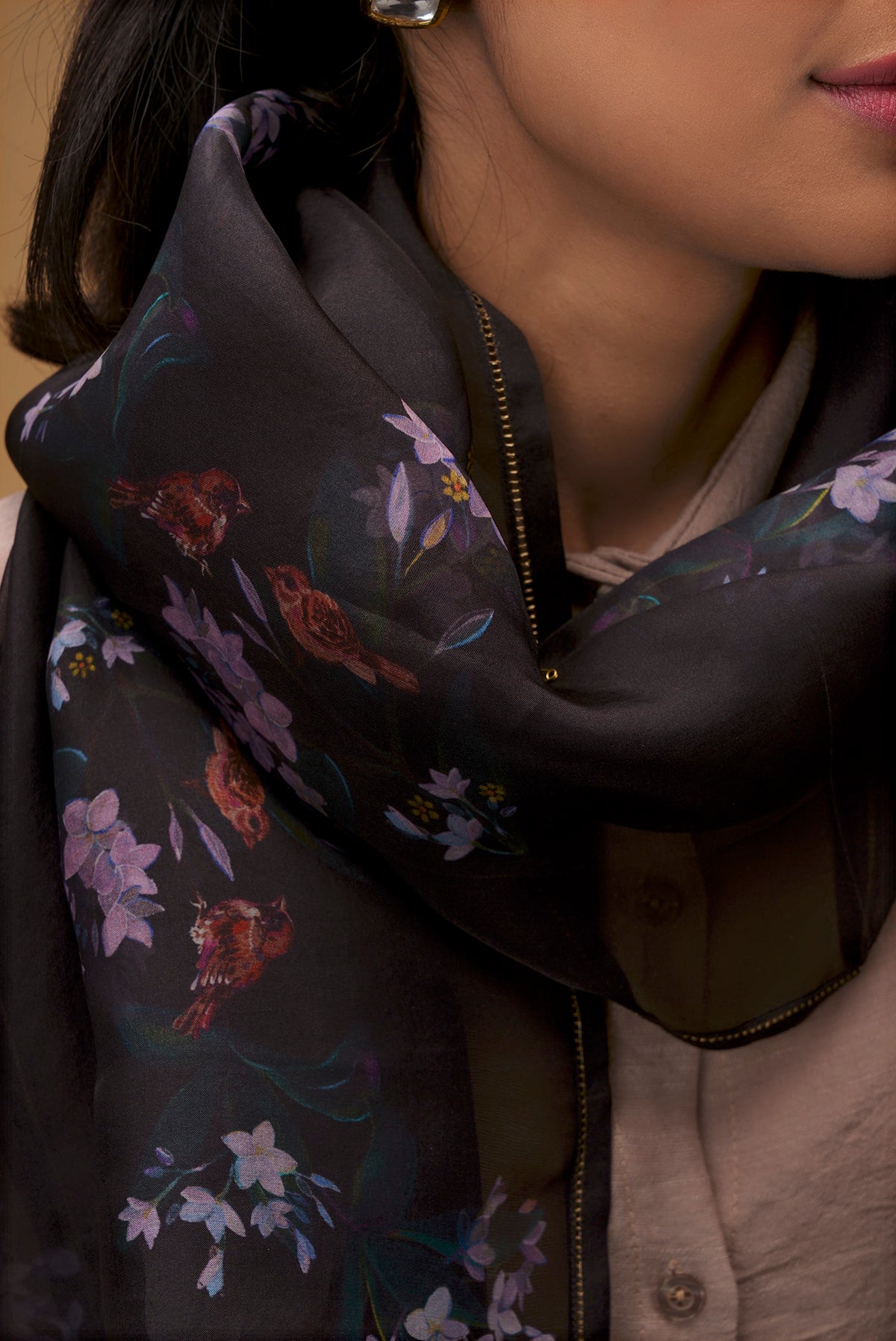 Close up of Black Pure Organza Silk Saree with Bird Print on the body and Without Border displaying folds