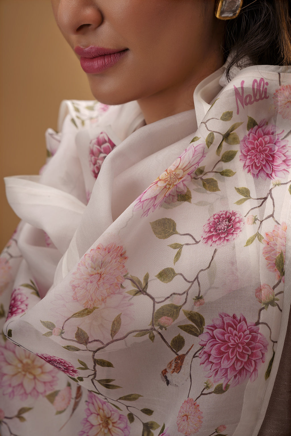 Close up of White Pure Organza Silk Saree with Bird Print on the body and Without Border displaying folds