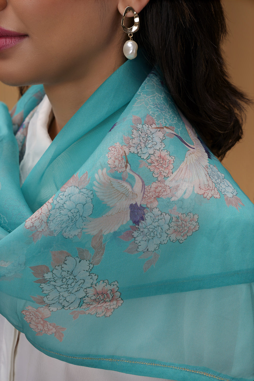 Close up of Blue Pure Organza Silk Saree with Bird Print on the body and Without Border displaying folds