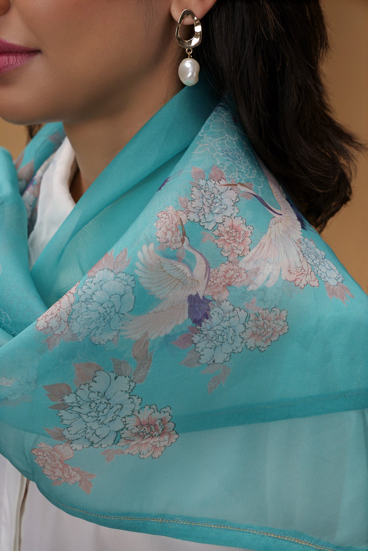 Close up of Blue Pure Organza Silk Saree with Bird Print on the body and Without Border displaying folds