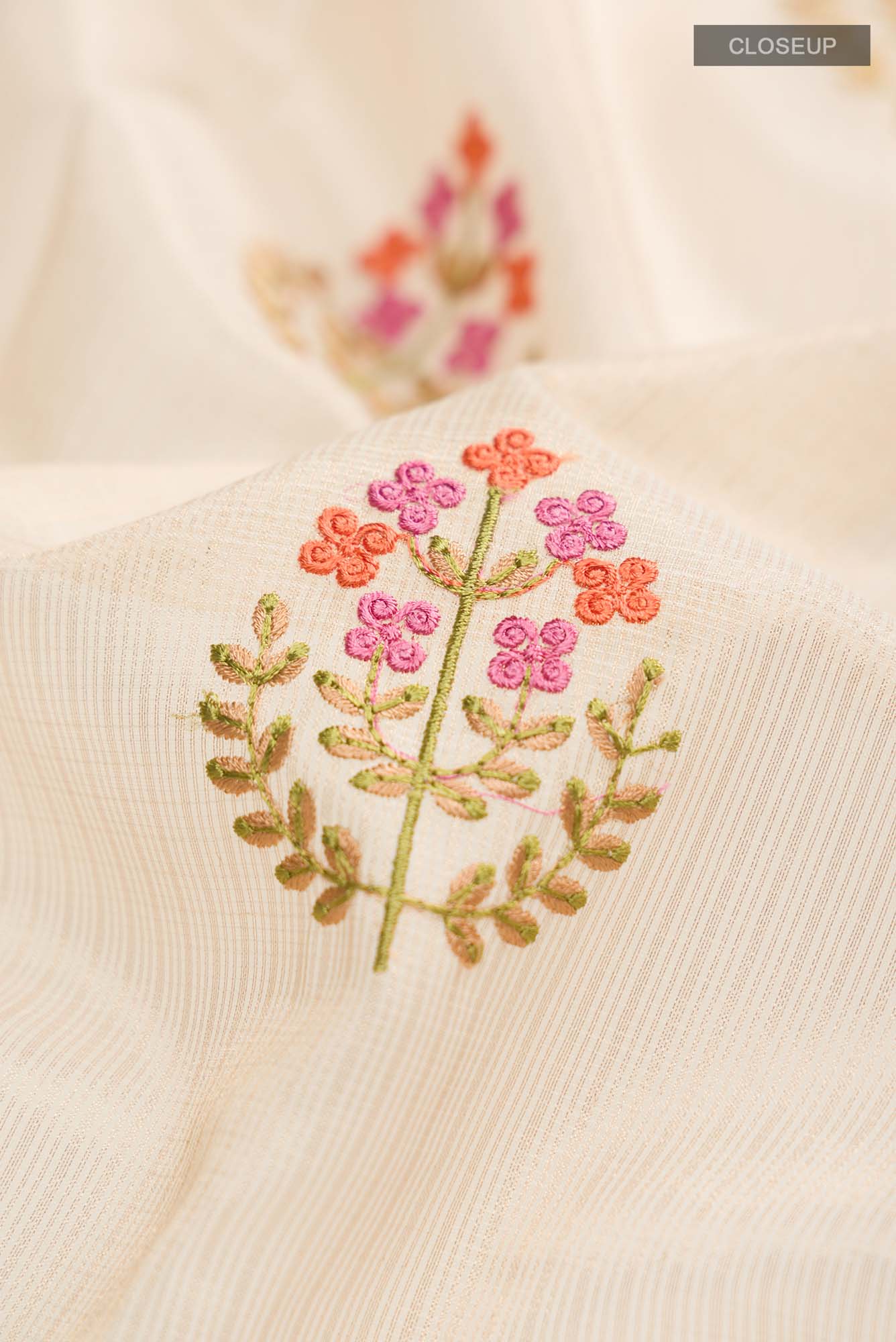 Close up of Gold Blended Kota Cotton Saree with Embroidery on the body and Zari And Thread Border.  displaying folds