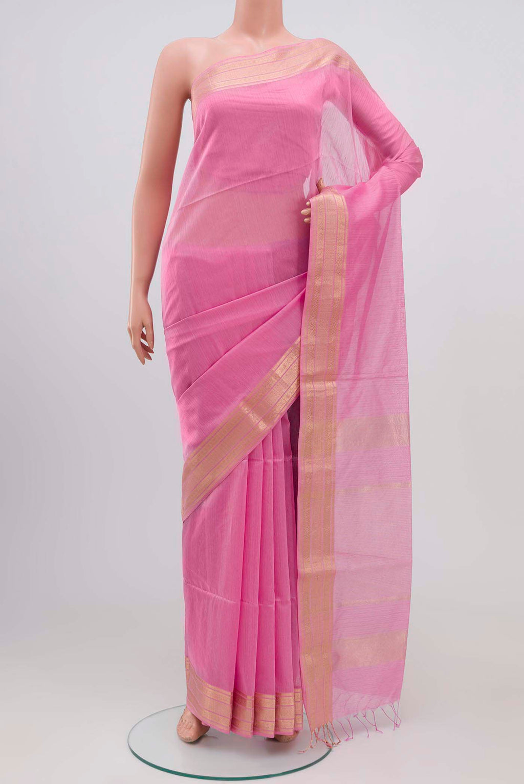Pink Maheshwari Silk Cotton Saree with Stripes on the body and Zari Border.  displayed on a mannequin