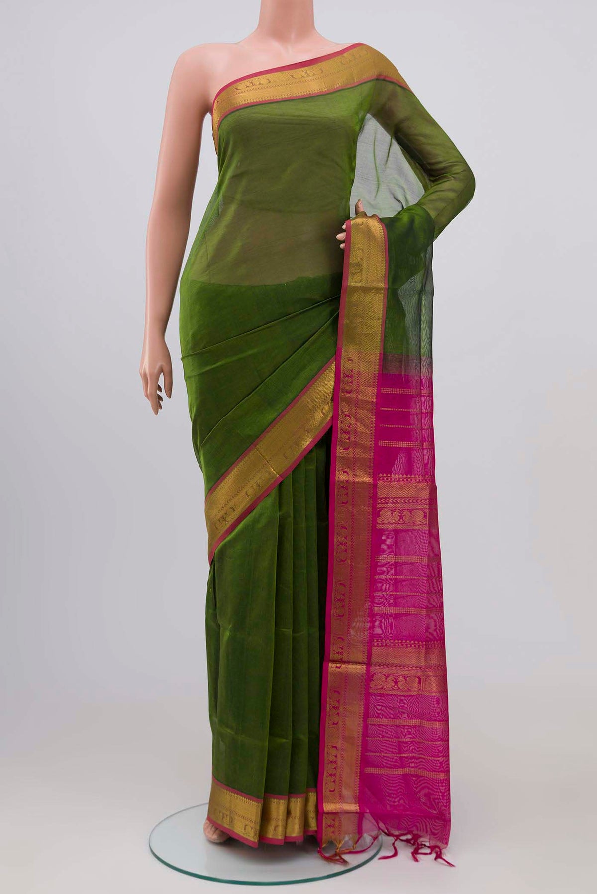 Green Silk Cotton Saree with Plain Body and Zari Border.  displayed on a mannequin