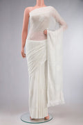 White Blended Chiffon Saree with Embroidery on the body and Embroidery Border.  displayed on a mannequin