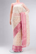 Cream Blended Kora Cotton Saree with Embroidery on the body and Zari Border.  displayed on a mannequin