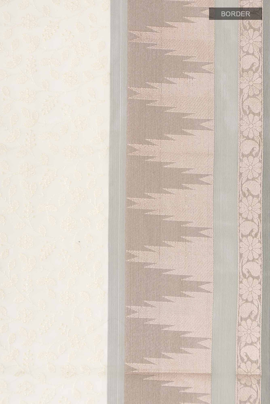 Border image of Cream Blended Kora Cotton Saree with Embroidery on the body and Zari And Thread Border. 