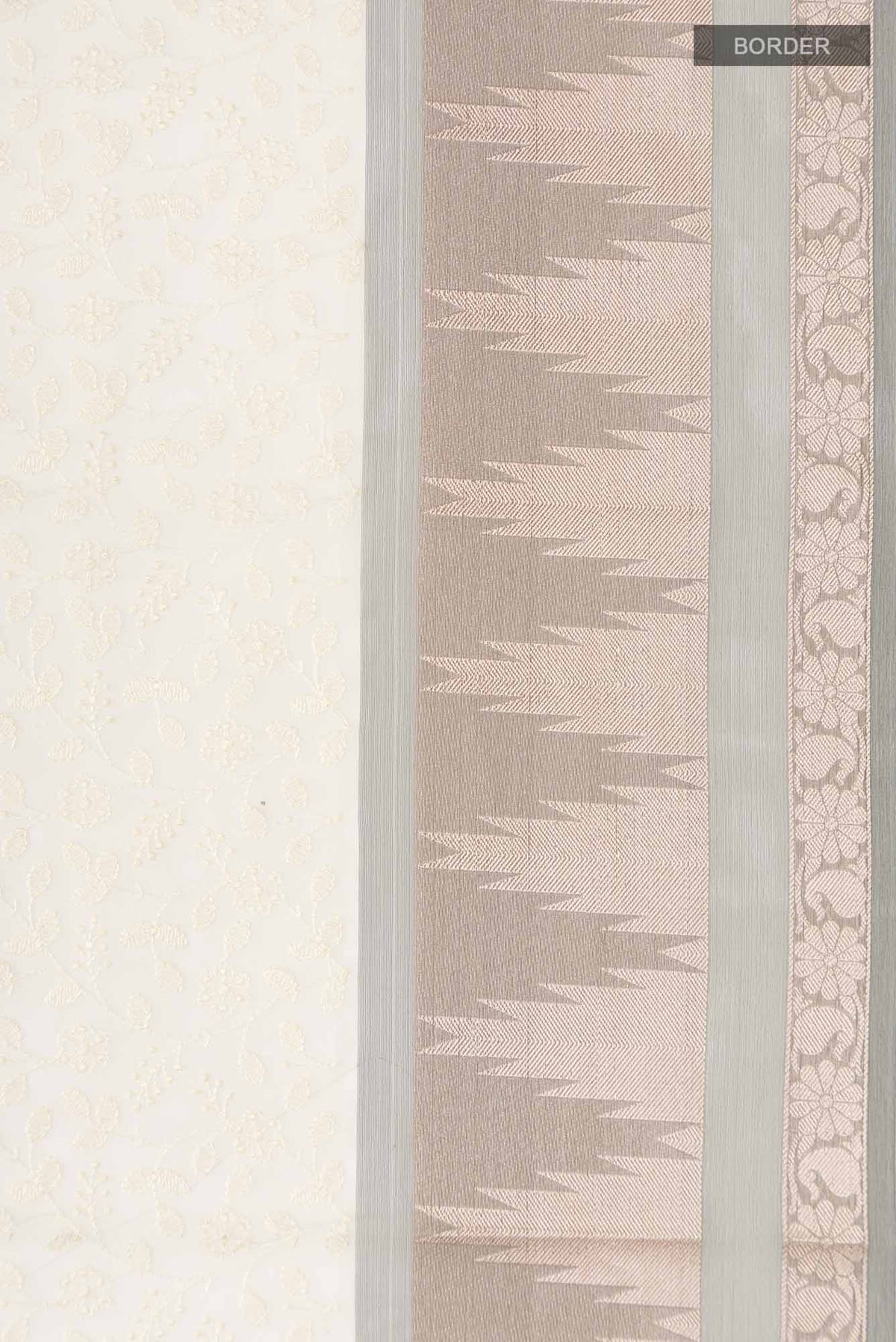 Border image of Cream Blended Kora Cotton Saree with Embroidery on the body and Zari And Thread Border. 