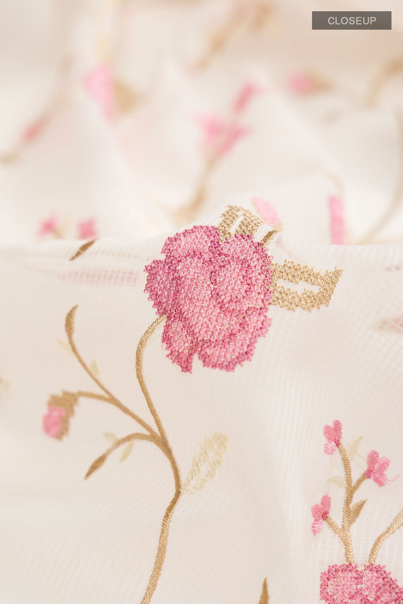 Close up of Cream Blended Kota Cotton Saree with Embroidery on the body and Thread Border.  displaying folds