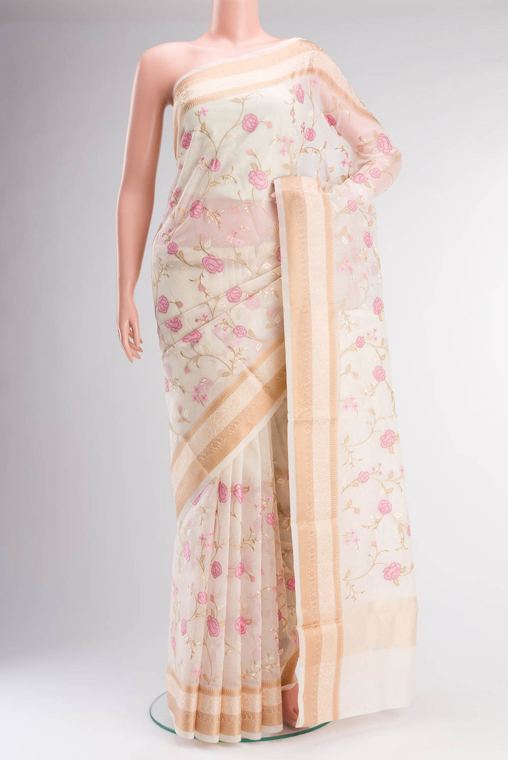 Cream Blended Kota Cotton Saree with Embroidery on the body and Thread Border.  displayed on a mannequin