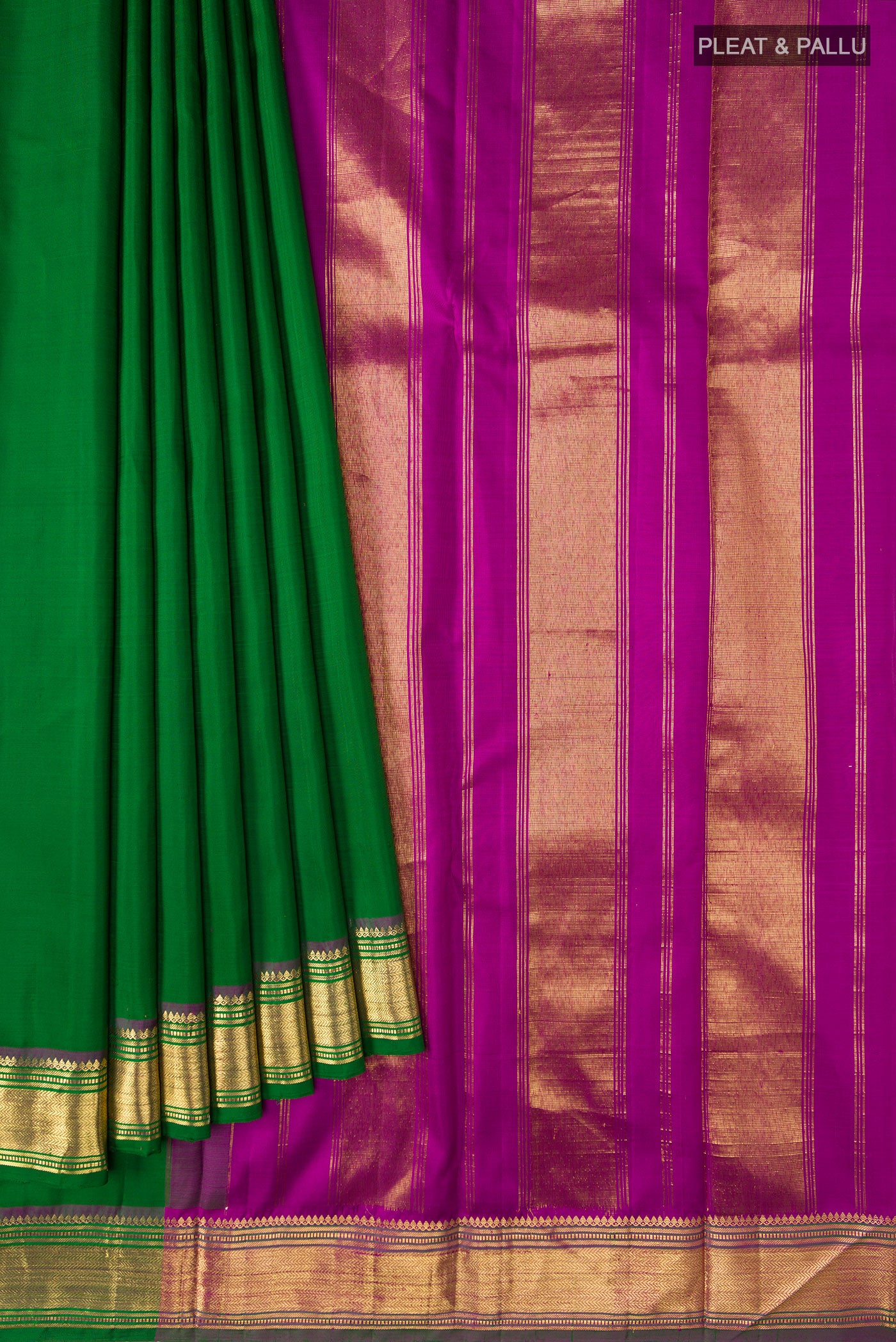 Pleats and pallu of Green Kanchipuram Silk Saree with Plain Body and Zari Border. 