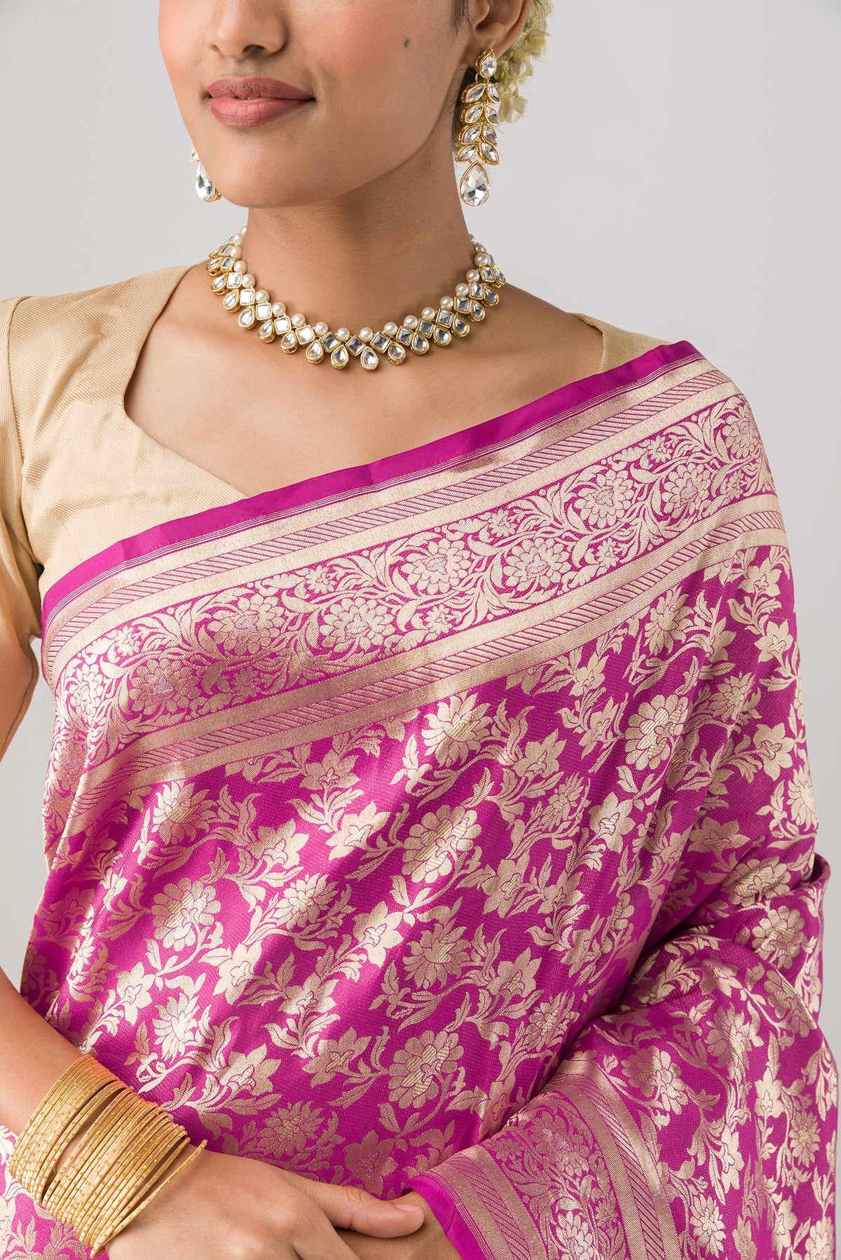 Close up of Pink Banarasi Silk Saree with Zari Brocade on the body and Zari Border displaying folds