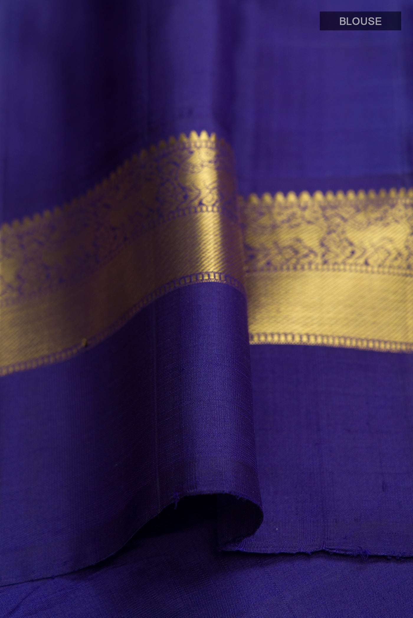 Close up image of the blouse of Peach Kanjivaram Silk Saree with Plain Body and Zari Border. 