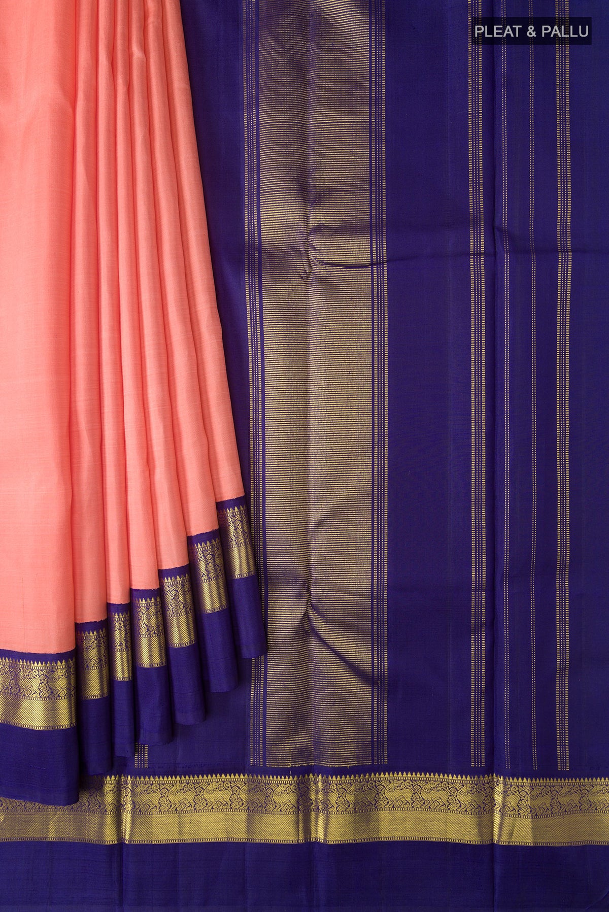 Pleats and pallu of Peach Kanjivaram Silk Saree with Plain Body and Zari Border. 