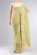 Green Blended Kota Cotton Saree with Embroidery on the body and Zari Border.  displayed on a mannequin